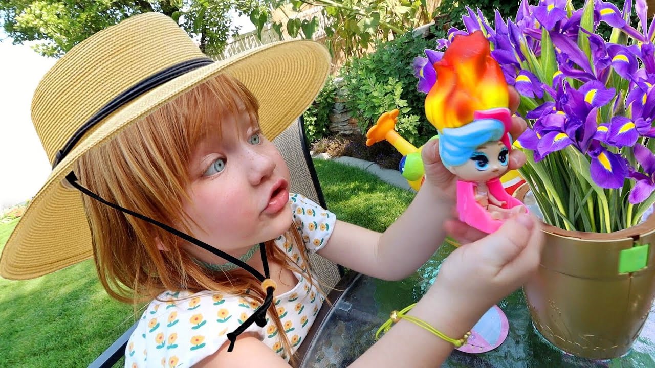 BACKYARD FLOWER SURPRiSE!! Adley helps water the garden, petal pets ...